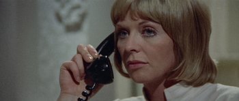 Movie still from “Images” (1972), directed by Robert Altman – A person talking on a phone; Close Up shot, Low angle