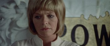 Movie still from “Images” (1972), directed by Robert Altman – A person wearing a white shirt; Close Up shot, Low angle