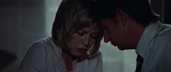 Movie still from “Images” (1972), directed by Robert Altman – A man and a woman sitting next to each other; Close Up shot, Low angle