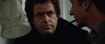 Movie still from “Images” (1972), directed by Robert Altman – A person with a cigarette in his mouth; Close Up shot, Low angle