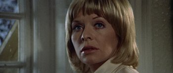 Movie still from “Images” (1972), directed by Robert Altman – A person wearing a white shirt; Close Up shot, Low angle