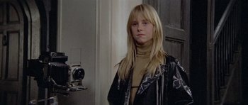 Movie still from “Images” (1972), directed by Robert Altman – A young blonde woman wearing a black leather jacket; Close Up shot, Low angle