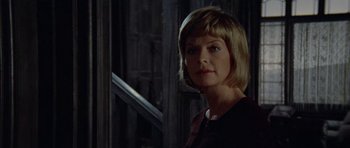 Movie still from “Images” (1972), directed by Robert Altman – A person with short blonde hair; Close Up shot, Low angle