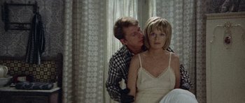 Movie still from “Images” (1972), directed by Robert Altman – A man and a woman in a white dress; Medium shot, Overhead angle