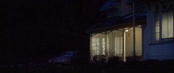 Movie still from “Images” (1972), directed by Robert Altman – A car parked in front of a house at night; Extreme Wide shot, Low angle