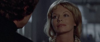 Movie still from “Images” (1972), directed by Robert Altman – A person looking at a camera; Close Up shot, Over the shoulder angle