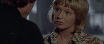 Movie still from “Images” (1972), directed by Robert Altman – A person with short blonde hair; Close Up shot, Over the shoulder angle