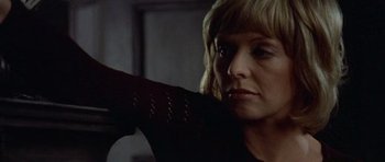 Movie still from “Images” (1972), directed by Robert Altman – A person holding something in her hand; Close Up shot, Low angle