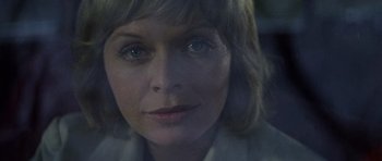 Movie still from “Images” (1972), directed by Robert Altman – A woman's face in a car window; Close Up shot, Low angle