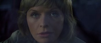Movie still from “Images” (1972), directed by Robert Altman – A woman's face with blue eyes; Extreme Close Up shot, Low angle