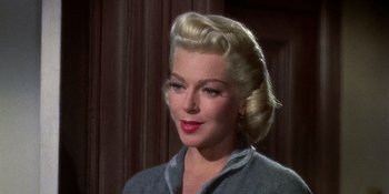 Movie still from “Imitation of Life” (1959), directed by Douglas Sirk – A person wearing a jacket; Close Up shot, Low angle