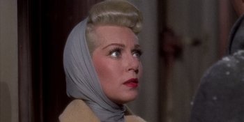 Movie still from “Imitation of Life” (1959), directed by Douglas Sirk – A woman wearing a head scarf; Close Up shot, Low angle