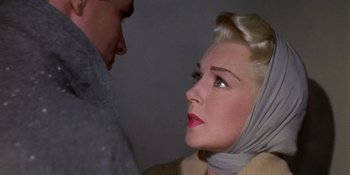 Movie still from “Imitation of Life” (1959), directed by Douglas Sirk – A man and a woman looking at one another; Close Up shot, Over the shoulder angle