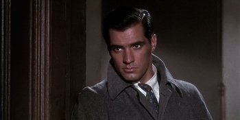 Movie still from “Imitation of Life” (1959), directed by Douglas Sirk – A man wearing a coat and a tie; Close Up shot, Over the shoulder angle
