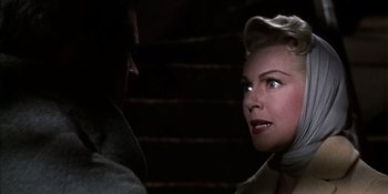 Movie still from “Imitation of Life” (1959), directed by Douglas Sirk – A man and a woman looking at one another; Close Up shot, Over the shoulder angle