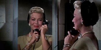 Movie still from “Imitation of Life” (1959), directed by Douglas Sirk – An older woman is talking on a phone; Close Up shot, Low angle