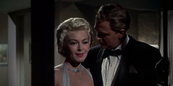 Movie still from “Imitation of Life” (1959), directed by Douglas Sirk – A man and a woman standing next to each other; Close Up shot, Low angle