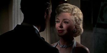 Movie still from “Imitation of Life” (1959), directed by Douglas Sirk – A man and a woman are looking at one another; Close Up shot, Over the shoulder angle