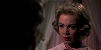Movie still from “Imitation of Life” (1959), directed by Douglas Sirk – A person wearing a pink shirt; Close Up shot, Over the shoulder angle