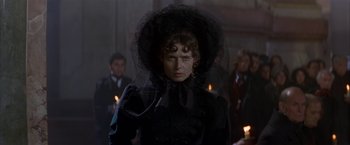 Movie still from “Immortal Beloved” (1994), directed by Bernard Rose – A woman in a black dress and a black hat; Close Up shot, Over the shoulder angle