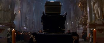 Movie still from “Immortal Beloved” (1994), directed by Bernard Rose – A large black chair in the middle of a room; Wide shot, High angle