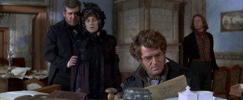 Movie still from “Immortal Beloved” (1994), directed by Bernard Rose – A man and a woman sitting at a table; Medium shot, High angle