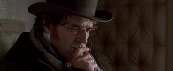 Movie still from “Immortal Beloved” (1994), directed by Bernard Rose – An older man wearing glasses and a hat; Close Up shot, Over the shoulder angle
