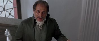 Movie still from “Immortal Beloved” (1994), directed by Bernard Rose – An old man with a beard and mustache wearing a green jacket; Close Up shot, Low angle