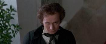 Movie still from “Immortal Beloved” (1994), directed by Bernard Rose – A person wearing a suit and tie; Close Up shot, Over the shoulder angle