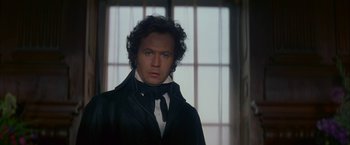 Movie still from “Immortal Beloved” (1994), directed by Bernard Rose – A person wearing a suit and tie; Close Up shot, Over the shoulder angle