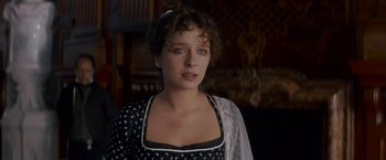 Movie still from “Immortal Beloved” (1994), directed by Bernard Rose – A person wearing a dress; Close Up shot, Over the shoulder angle