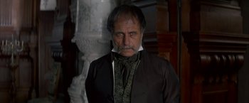 Movie still from “Immortal Beloved” (1994), directed by Bernard Rose – A person wearing a suit and tie; Close Up shot, Over the shoulder angle