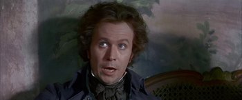 Movie still from “Immortal Beloved” (1994), directed by Bernard Rose – A person wearing a suit and tie; Close Up shot, High angle