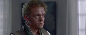 Movie still from “Immortal Beloved” (1994), directed by Bernard Rose – A person wearing a vest; Close Up shot, Over the shoulder angle