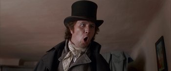 Movie still from “Immortal Beloved” (1994), directed by Bernard Rose – A person wearing a top hat; Close Up shot, Low angle