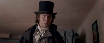 Movie still from “Immortal Beloved” (1994), directed by Bernard Rose – A person wearing a top hat; Close Up shot, Over the shoulder angle