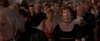 Movie still from “Immortal Beloved” (1994), directed by Bernard Rose – A group of people in a room with one woman wearing a tiara; Close Up shot, Over the shoulder angle