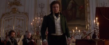 Movie still from “Immortal Beloved” (1994), directed by Bernard Rose – A man in a green jacket standing in front of a crowd; Medium shot, Low angle