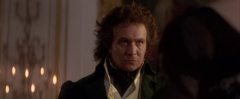 Movie still from “Immortal Beloved” (1994), directed by Bernard Rose – A person wearing a suit and tie; Close Up shot, Over the shoulder angle
