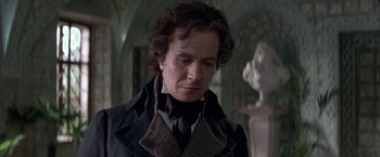 Movie still from “Immortal Beloved” (1994), directed by Bernard Rose – A person wearing a coat and tie; Close Up shot, Over the shoulder angle