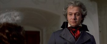 Movie still from “Immortal Beloved” (1994), directed by Bernard Rose – A person wearing a suit and tie; Close Up shot, Low angle