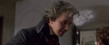 Movie still from “Immortal Beloved” (1994), directed by Bernard Rose – A person wearing a suit and tie; Close Up shot, Over the shoulder angle