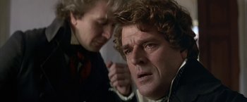 Movie still from “Immortal Beloved” (1994), directed by Bernard Rose – A man with curly brown hair and a man with curly brown hair; Close Up shot, Over the shoulder angle