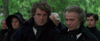 Movie still from “Immortal Beloved” (1994), directed by Bernard Rose – A man in a black coat and a man in a black coat; Close Up shot, Over the shoulder angle