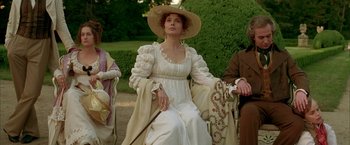 Movie still from “Immortal Beloved” (1994), directed by Bernard Rose – A woman in a white dress and a straw hat holding a cane; Medium shot, High angle