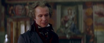 Movie still from “Immortal Beloved” (1994), directed by Bernard Rose – A person wearing a suit and tie; Close Up shot, Over the shoulder angle