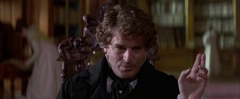 Movie still from “Immortal Beloved” (1994), directed by Bernard Rose – A person wearing a suit and tie; Close Up shot, Over the shoulder angle