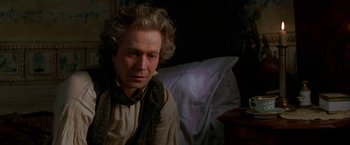 Movie still from “Immortal Beloved” (1994), directed by Bernard Rose – An old man sitting on a bed in a dark room; Close Up shot, Over the shoulder angle