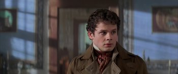 Movie still from “Immortal Beloved” (1994), directed by Bernard Rose – A man in a brown coat and a neck tie; Close Up shot, Over the shoulder angle