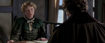 Movie still from “Immortal Beloved” (1994), directed by Bernard Rose – A woman sitting in front of a mirror while looking at another woman; Medium shot, Over the shoulder angle